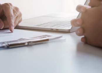 Two People Discussing Car Purchase Details